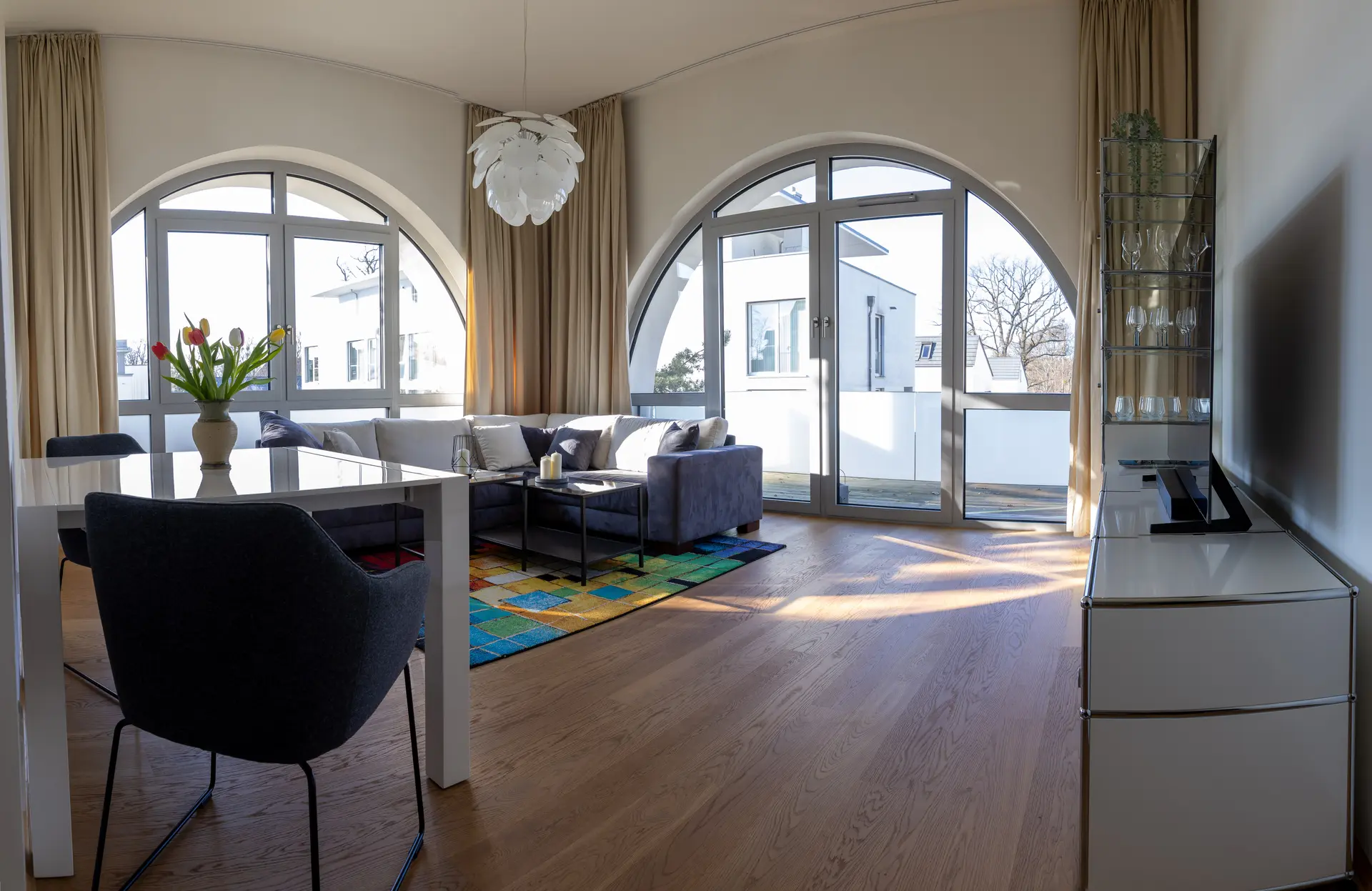 Spacious living room with arched windows